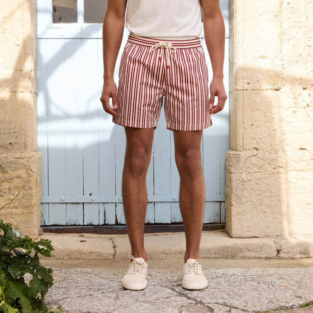 Ecru swim shorts with burgundy stripes in Seaqual®